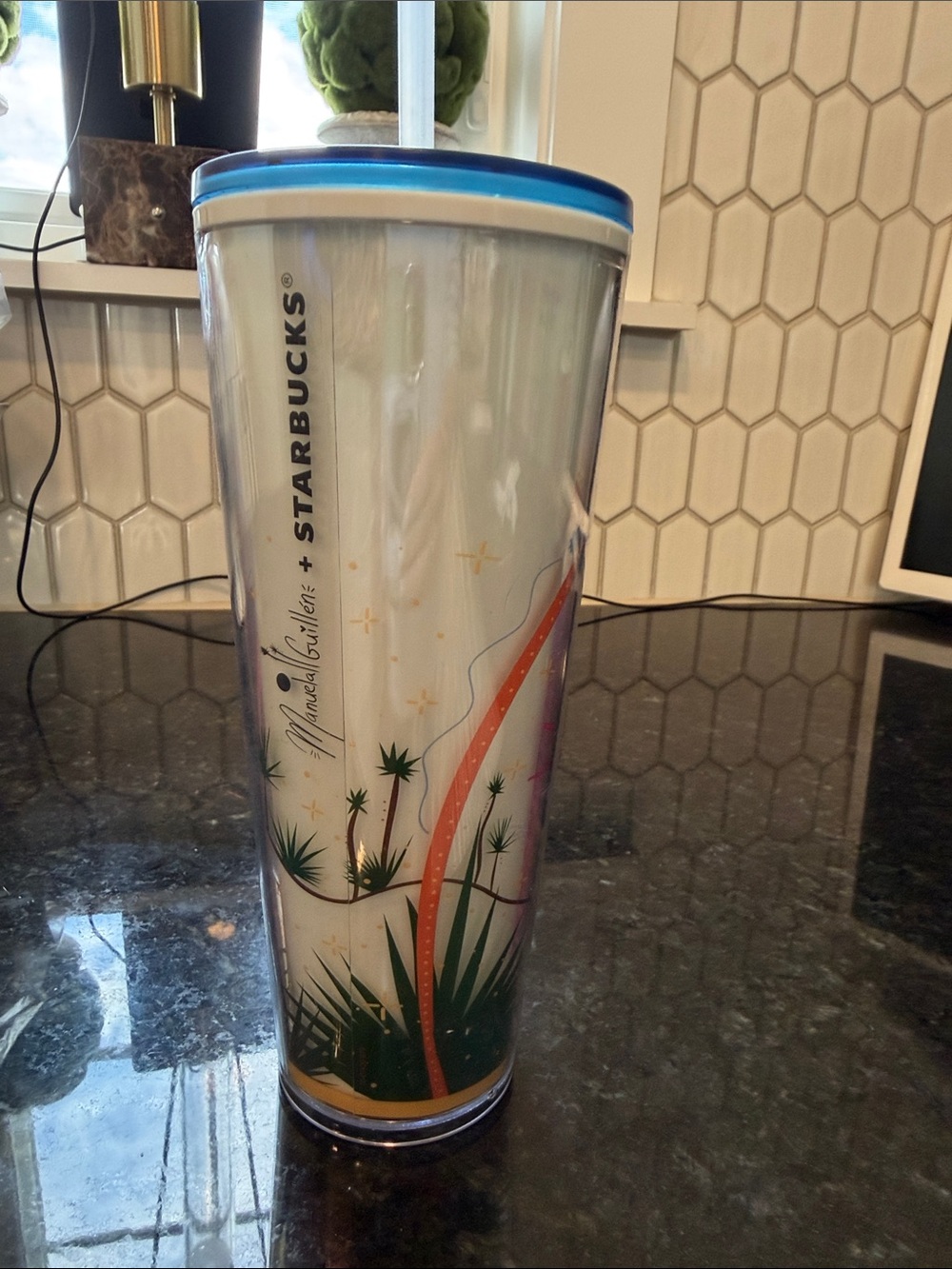 Starbucks White Tumbler with Blue Lid and Multi-Color Botanical Design